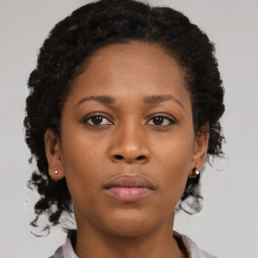 Neutral black young-adult female with short  brown hair and brown eyes