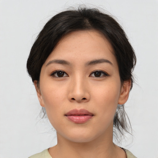 Neutral asian young-adult female with medium  brown hair and brown eyes