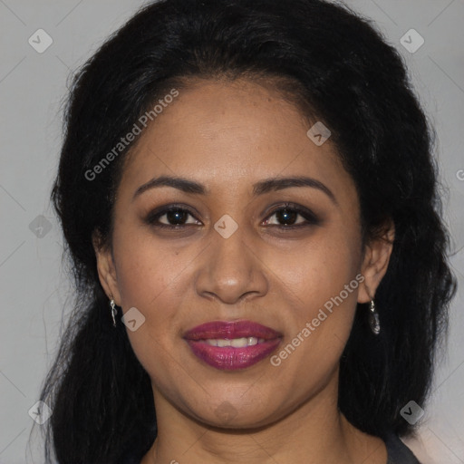 Joyful latino young-adult female with long  brown hair and brown eyes