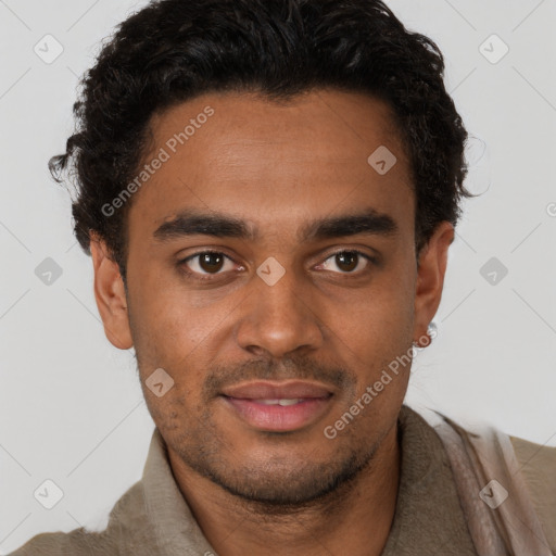 Joyful black young-adult male with short  brown hair and brown eyes