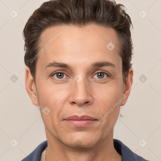 Joyful white adult male with short  brown hair and grey eyes