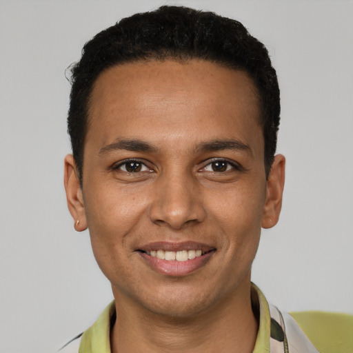 Joyful white young-adult male with short  brown hair and brown eyes