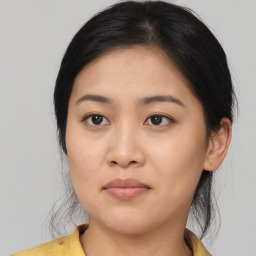 Joyful asian young-adult female with medium  brown hair and brown eyes