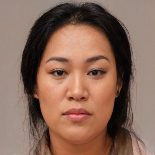 Neutral asian young-adult female with medium  brown hair and brown eyes