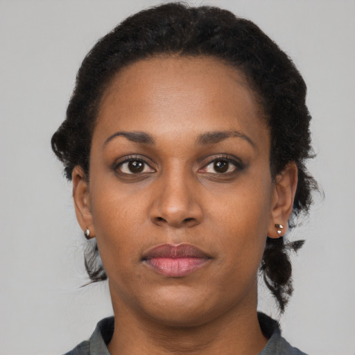 Neutral black young-adult female with short  brown hair and brown eyes