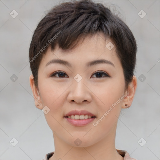 Joyful asian young-adult female with short  brown hair and brown eyes