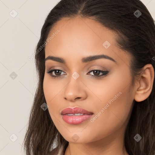 Joyful latino young-adult female with long  brown hair and brown eyes