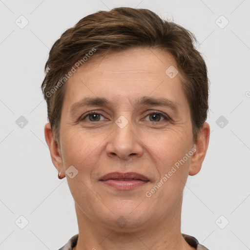 Joyful white adult female with short  brown hair and brown eyes