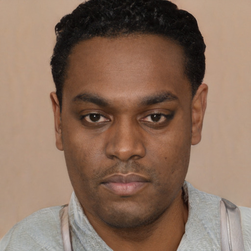 Neutral black young-adult male with short  black hair and brown eyes