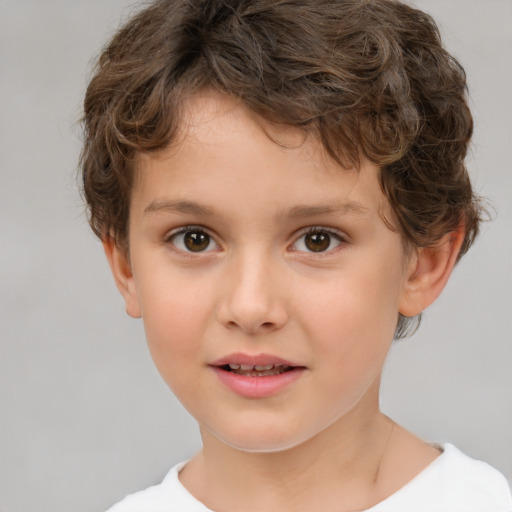 Joyful white child male with short  brown hair and brown eyes