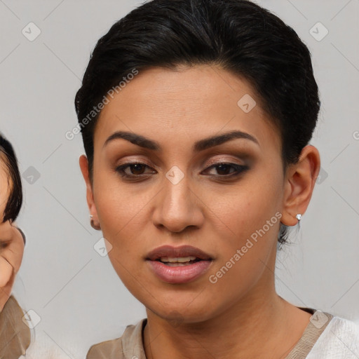 Joyful latino young-adult female with short  brown hair and brown eyes