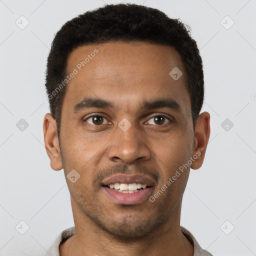 Joyful latino young-adult male with short  brown hair and brown eyes