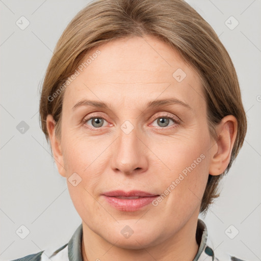 Joyful white adult female with medium  brown hair and grey eyes