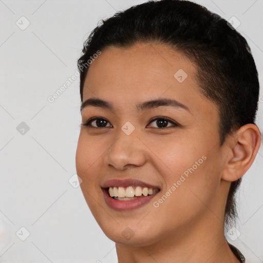 Joyful latino young-adult female with short  black hair and brown eyes