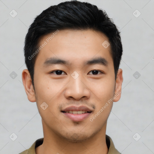 Joyful asian young-adult male with short  black hair and brown eyes