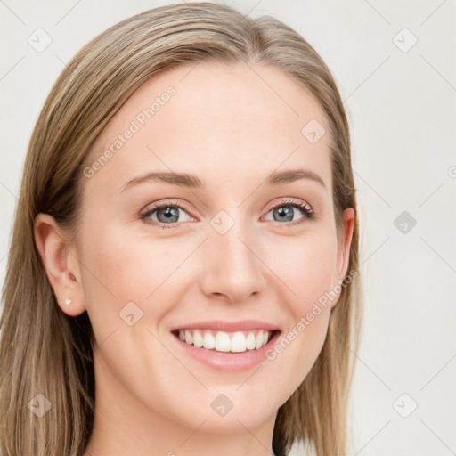 Joyful white young-adult female with long  brown hair and blue eyes