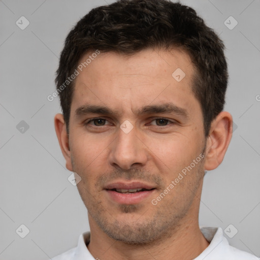 Joyful white young-adult male with short  brown hair and brown eyes