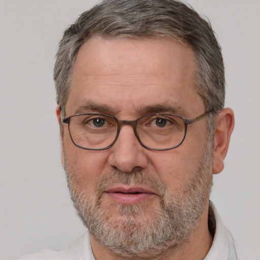 Neutral white middle-aged male with short  gray hair and brown eyes