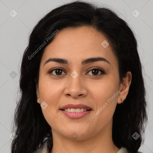 Joyful latino young-adult female with long  brown hair and brown eyes