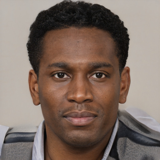 Neutral black young-adult male with short  black hair and brown eyes