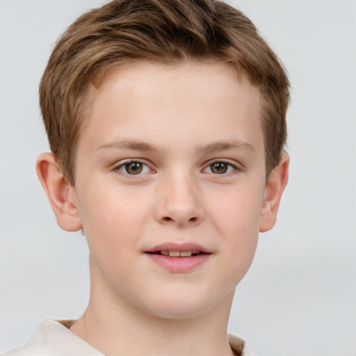 Joyful white child male with short  brown hair and grey eyes