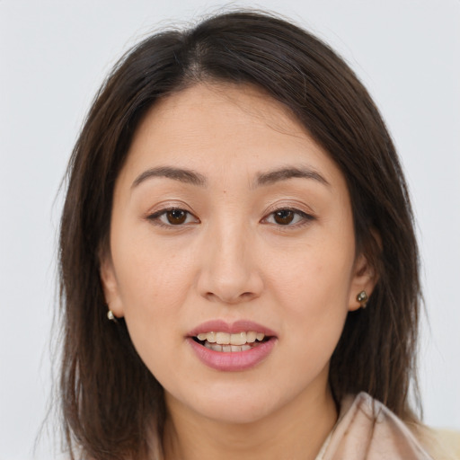 Joyful white young-adult female with long  brown hair and brown eyes