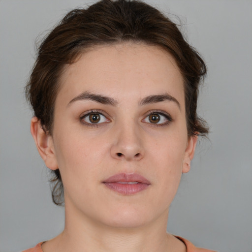 Neutral white young-adult female with short  brown hair and brown eyes