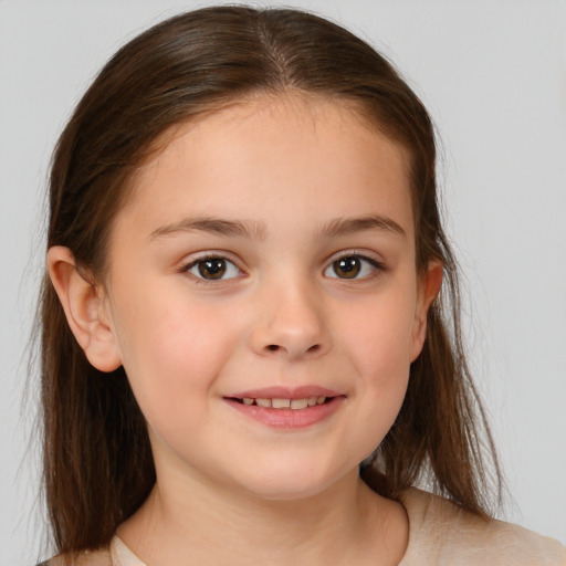 Joyful white child female with medium  brown hair and brown eyes