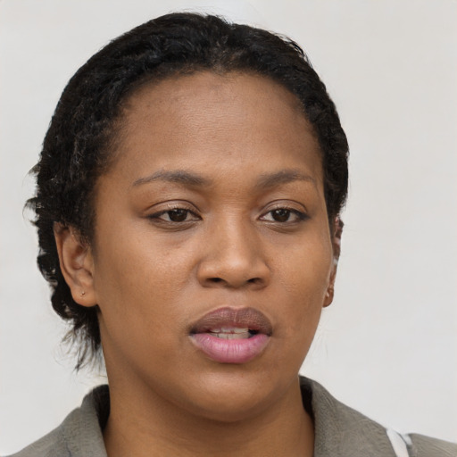 Neutral black young-adult female with short  black hair and brown eyes