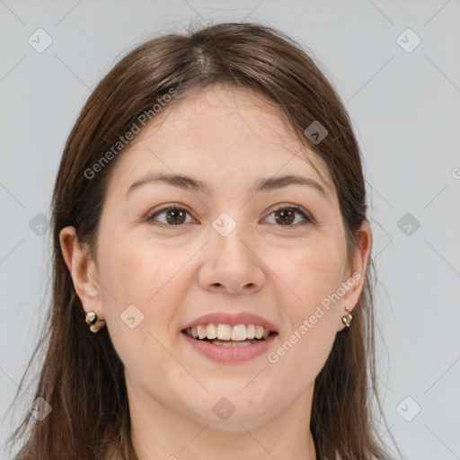 Joyful white adult female with long  brown hair and brown eyes