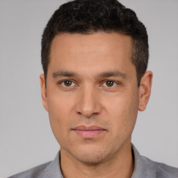 Neutral white young-adult male with short  black hair and brown eyes