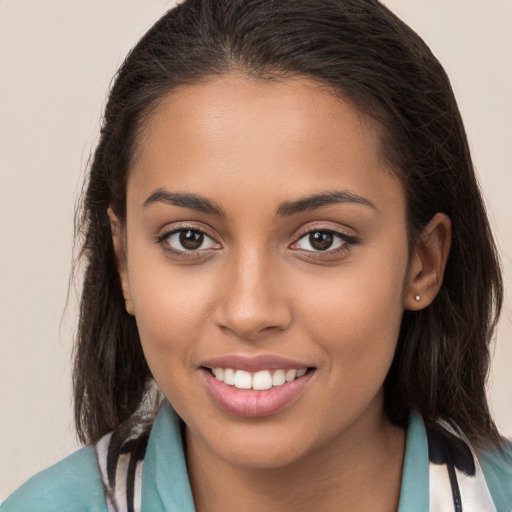 Joyful white young-adult female with long  brown hair and brown eyes