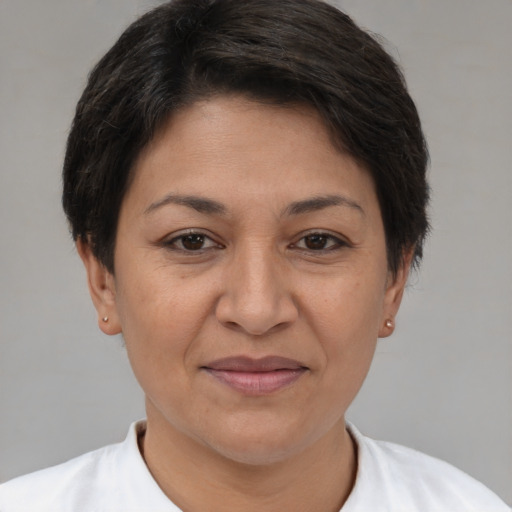 Joyful white adult female with short  brown hair and brown eyes