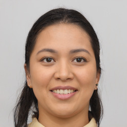 Joyful white young-adult female with medium  brown hair and brown eyes