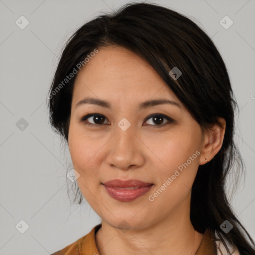 Joyful asian adult female with medium  brown hair and brown eyes