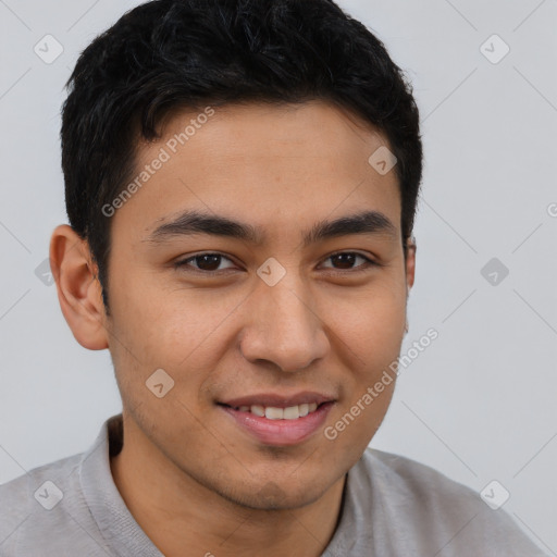 Joyful latino young-adult male with short  brown hair and brown eyes