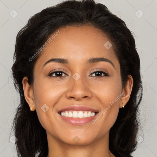 Joyful latino young-adult female with long  brown hair and brown eyes