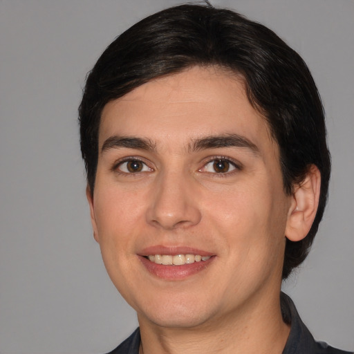 Joyful white young-adult male with medium  brown hair and brown eyes