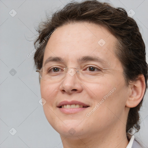 Joyful white adult female with medium  brown hair and brown eyes