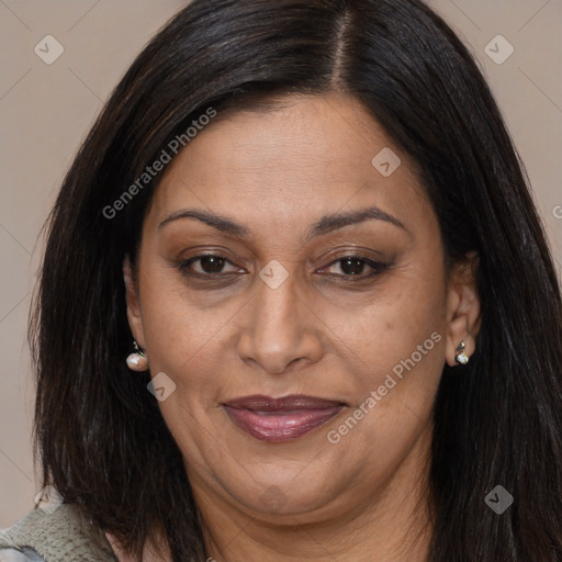 Joyful latino adult female with long  brown hair and brown eyes