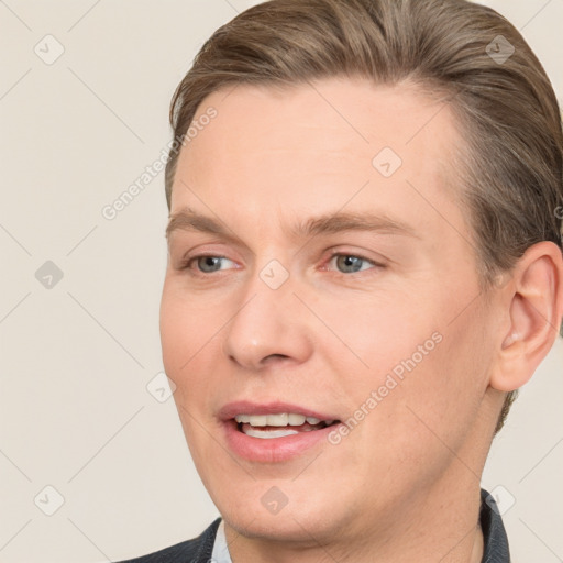 Joyful white young-adult male with short  brown hair and grey eyes