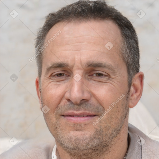 Joyful white middle-aged male with short  brown hair and brown eyes