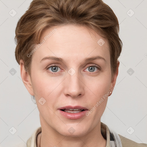 Joyful white young-adult female with short  brown hair and grey eyes