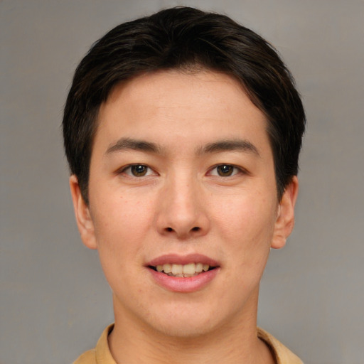 Joyful asian young-adult male with short  brown hair and brown eyes