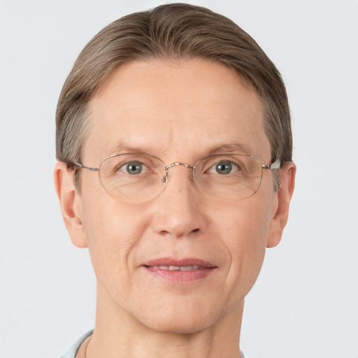 Joyful white adult male with short  brown hair and grey eyes