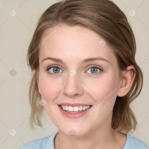 Joyful white young-adult female with medium  brown hair and blue eyes