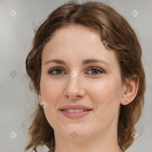 Joyful white young-adult female with medium  brown hair and green eyes