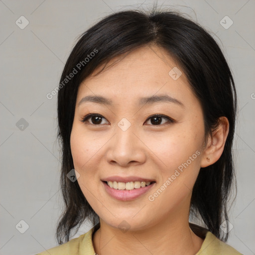 Joyful asian young-adult female with medium  brown hair and brown eyes