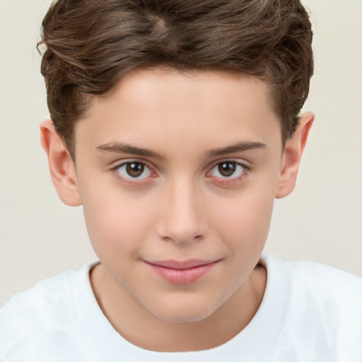 Joyful white child male with short  brown hair and brown eyes