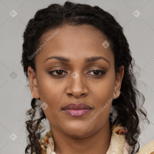 Joyful black young-adult female with long  brown hair and brown eyes